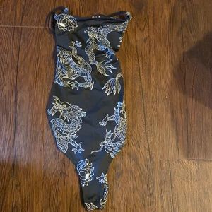 Body suit with strapped back